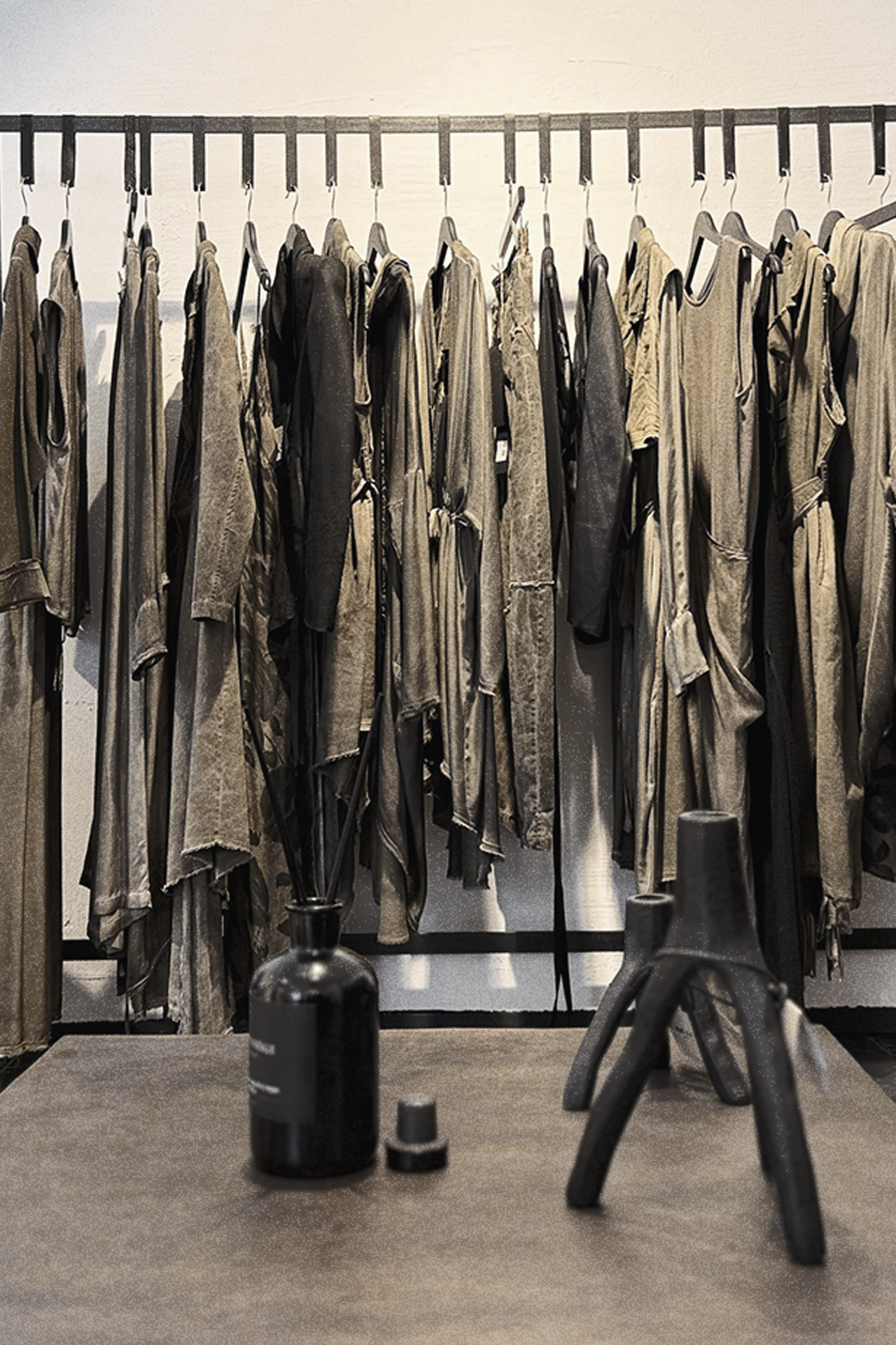 Clothing rail, objects and display surface inside TEPHRΛ Athens